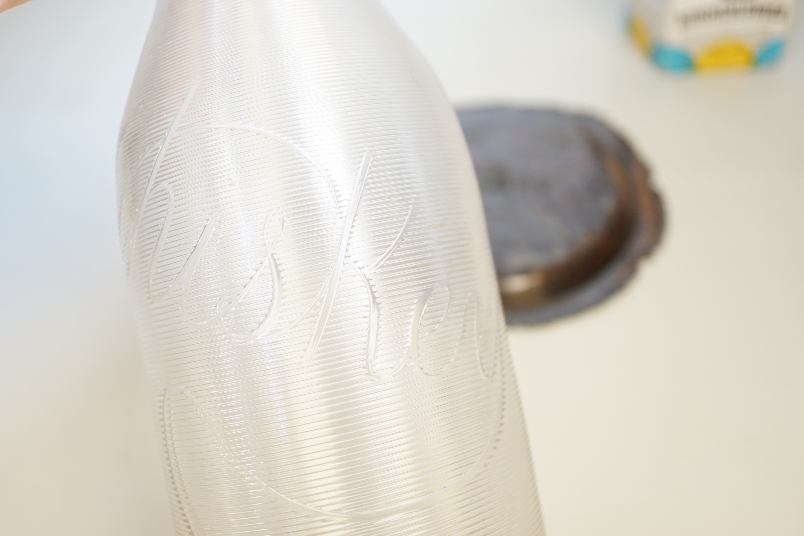 A silver-mounted ‘Whiskey’ decanter, 31cm, a boxed Lufthansa Bommerlunder, and a cast chinoiserie dish